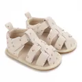 Vista detallada de sandalias beige para bebé con estampado floral rosa y suela suave - Albaricoque