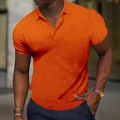 Detailed view of a slim fit men's orange short sleeve polo shirt with textured fabric - S / Tops / Orange