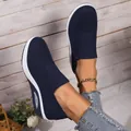 Detail of navy blue fly-knit slip-on sneakers with air cushion sole and knit texture - 36 / Navy Blue