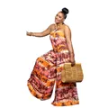 Detail view of a halter neck backless jumpsuit with vibrant tropical sunset print - S / Jumpsuits / Orange
