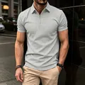Detail of a men's light grey waffle knit polo shirt with a functional zipper closure - S / Tops / Gray