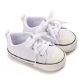 Side view detail of white baby canvas sneakers with soft soles for pre-walking infants - Insole Length 11cm / White
