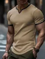 Close-up of men's khaki waffle knit T-shirt featuring a black contrast V-neck collar - Dark Khaki