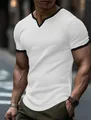 Detailed texture of men's white V-neck T-shirt with contrast black trim and grid pattern fabric - White