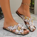 Close-up perspective of women's comfortable flat slippers featuring a vibrant butterfly print - Light Gray