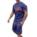 Close-up detail of navy blue men's summer tracksuit set featuring red Brooklyn print - S / Top And Bottom / Navy Blue
