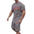 Full body view of grey Brooklyn print t-shirt and shorts set on male model for fit detail - Dark Gray