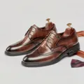 Men's brown leather brogue derby shoes featuring elegant wingtip carving details - Dark Brown