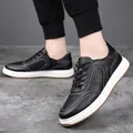 Close-up of black cowhide leather men's sneakers with white stitching and thick soles - 37 / Black (Hollow Style)