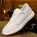 Close-up of premium white leather men's casual sneakers showing fine grain texture - 37 / White (Four Seasons Style)