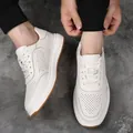 Close-up detail of men's white cowhide leather sneakers with perforated design. - 37 / White (Hollow Out)