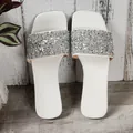 Top view of white flat sandals with sparkling silver sequin straps for summer - White