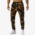 Detailed view of men's camouflage cargo joggers with elastic waist and drawstring. - M / Bottoms / Army Green