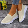 Close-up of comfortable beige mesh slip-on loafers for women on a stylish marble floor - 36 / Off White