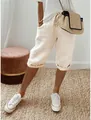 Détail du pantalon capri en coton et lin beige pour femme avec taille à cordon. - S / Bas / Abricot