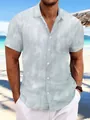 Men's light blue tie-dye short sleeve beach shirt styled in a tropical seaside setting. - S / Tops / Light Blue