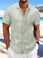 Close-up detail of a light green tie-dye short sleeve casual beach shirt for men - S / Tops / Light Green
