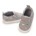 Close-up of grey baby slip-on shoes with colorful dinosaur patterns and soft soles - Insole Length 11cm / Gray