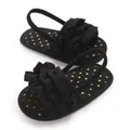 Close-up of black baby girl sandals with ruffles and gold polka dots soft sole - Insole Length 11cm / Black