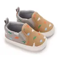 Close-up of baby canvas walking shoes with dinosaur pattern and soft white soles - Insole Length 11cm / Yellow Brown