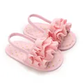 Close-up of pink baby girl ruffle sandals with gold polka dots and soft elastic strap - Insole Length 11cm / Pink