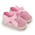 Detailed view of pink lace baby sandals featuring a decorative ribbon bow and soft woven sole - Insole Length 11cm / Pink
