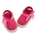 Close-up detail of breathable pink lace newborn baby sandals with a decorative bow - Insole Length 11cm / Peach