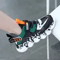 Lightweight breathable mesh boys' sneaker in black and green with a chunky non-slip sole - Dark Green