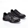 Close-up of black cowhide leather sneakers with textured pattern and soft soles - 40 / Black