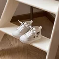 Side view of toddler canvas walking shoes with cute bear embroidery and soft white soles - Beige