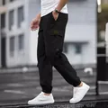 Men's stylish black cargo jogger pants with functional multi-pockets for urban streetwear - S / Bottoms / Black