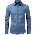 Close-up front view of a blue long-sleeved business dress shirt with black buttons. - Teal