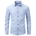 Close-up detail of a light blue long-sleeved business formal shirt for men with buttons - Light Blue