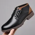 Detailed side view of men's black leather Martin boots featuring stylish brown heel accents - Black