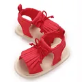 Detailed view of red baby girl walking sandals featuring fringe trim and soft soles. - Insole Length 11cm / Red