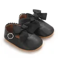 Vue détaillée de chaussures de princesse noires pour bébé avec de gros nœuds en ruban - Noir