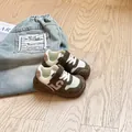 Close-up of breathable mesh fabric and soft rubber sole on these toddler walking shoes - Green
