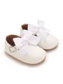 Detailed view of white PU baby princess shoes featuring large elegant ribbon bows - Insole Length 11cm / White