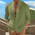 Close-up view of a men's vintage olive green linen shirt with stylish button detailing - Army Green
