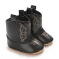 Close-up of stylish black baby girl cowboy boots with detailed decorative embroidery - Black
