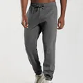 Close-up of men's dark grey jogger sweatpants with pintuck detail and drawstring waist - Dark Gray