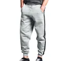 Detail view of men's casual grey sweatpants featuring double side stripes and drawstring - S / Bottoms / Light Gray