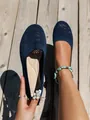 Detail shot of navy blue breathable fly-knit flat ballet shoes on a wooden background - Navy Blue