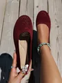 Detailed view of burgundy knit ballet flats with elegant pearl heel embellishment - Red