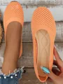 Close-up of orange mesh fly-knit flat shoes with a comfortable round toe design - Orange