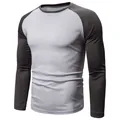Detailed view of a men's grey and black color-block raglan long-sleeve T-shirt - M / Tops / Light Gray/Dark Gray