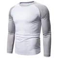 Close-up of men's long-sleeve raglan t-shirt with grey sleeves and white body design. - M / Tops / White Mix Grey