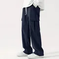Side view detail of men's loose navy blue corduroy cargo pants with side pockets - S / Bottoms / Navy Blue