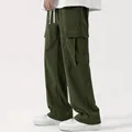 Detail view of men's dark green corduroy cargo pants with large side pockets - S / Bottoms / Army Green