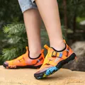Vibrant orange water shoes for swimming and beach activities featuring adjustable straps. - Orange Red